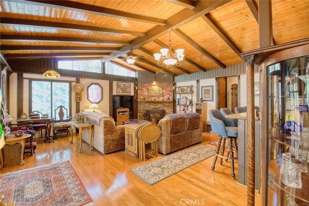 Chandelier, Dining room, Fireplace, Interior, Living room, Stone Walls, Wooden Beams, Wooden Ceilings, Wood Texture Flooring