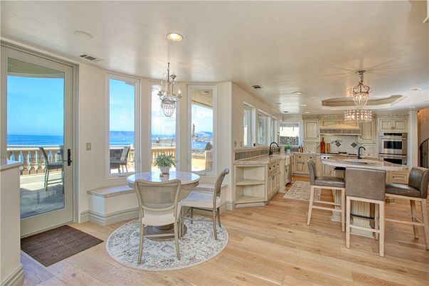 Chandelier, Dining room, Interior, Kitchen, Pendant Lights, Recessed Lighting, Stainless Steel Appliances, Water, Wood Texture Flooring