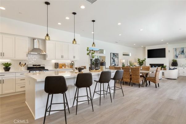 Dining room, Fireplace, Interior, Kitchen, Living room, Pendant Lights, Recessed Lighting, Stainless Steel Appliances, Wood Texture Flooring