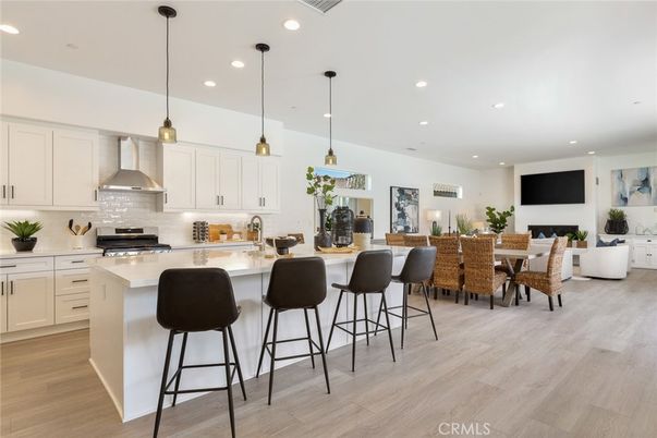 Dining room, Fireplace, Interior, Kitchen, Living room, Pendant Lights, Recessed Lighting, Stainless Steel Appliances, Wood Texture Flooring