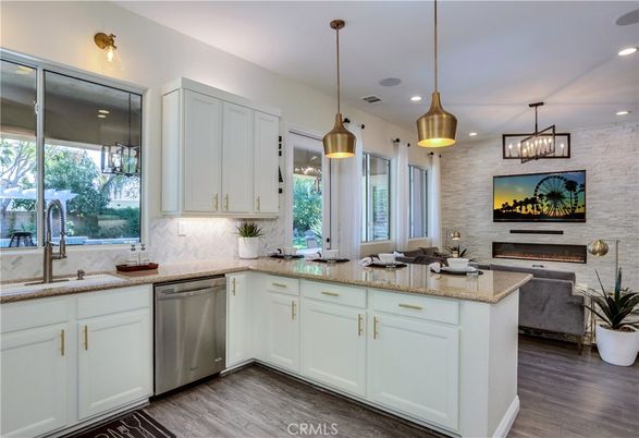 Fireplace, Interior, Kitchen, Pendant Lights, Recessed Lighting, Stainless Steel Appliances, Stone Walls, Wood Texture Flooring