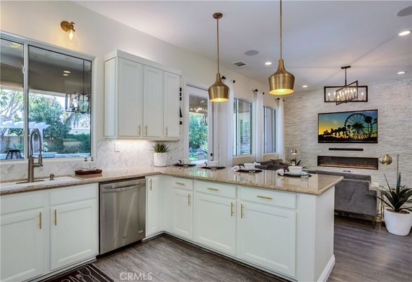 Fireplace, Interior, Kitchen, Pendant Lights, Recessed Lighting, Stainless Steel Appliances, Stone Walls, Wood Texture Flooring
