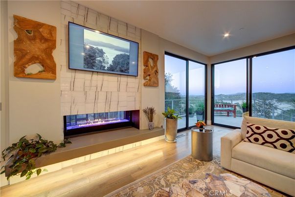 Fireplace, Interior, Living room, Recessed Lighting, Water, Wood Texture Flooring