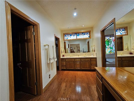 Bathroom, Dual Sink Vanities, Interior, Recessed Lighting, Wood Texture Flooring