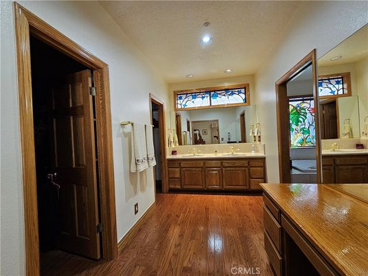 Bathroom, Dual Sink Vanities, Interior, Recessed Lighting, Wood Texture Flooring