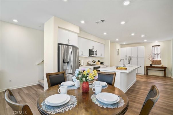 Dining room, Interior, Kitchen, Recessed Lighting, Stainless Steel Appliances, Wood Texture Flooring
