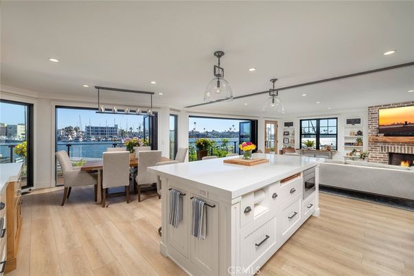 Dining room, Fireplace, Interior, Kitchen, Living room, Pendant Lights, Recessed Lighting, Water, Wood Texture Flooring