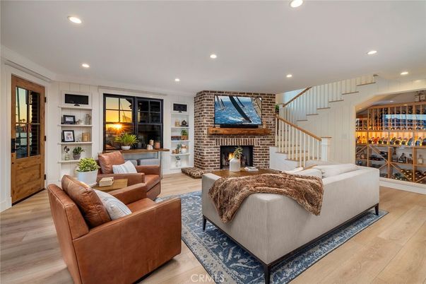 Fireplace, Interior, Living room, Recessed Lighting, Stone Walls, Wine Storage, Wood Texture Flooring