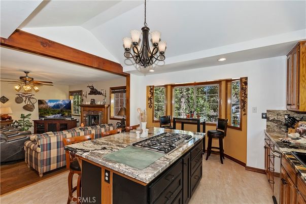 Chandelier, Fireplace, Interior, Kitchen, Living room, Recessed Lighting, Wood Texture Flooring