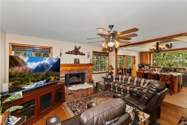 Chandelier, Dining room, Fireplace, Interior, Kitchen, Living room, Wood Texture Flooring