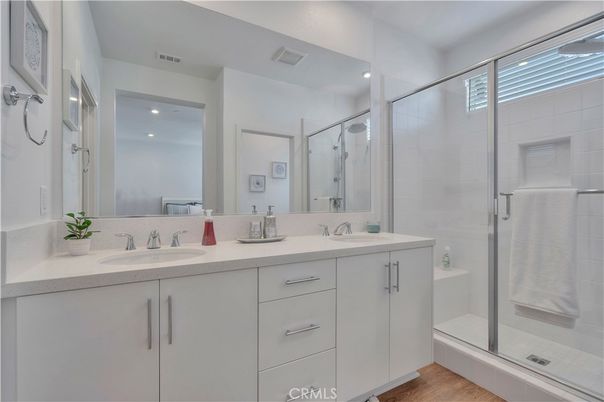 Bathroom, Dual Sink Vanities, Glass Shower, Interior, Recessed Lighting, Wood Texture Flooring