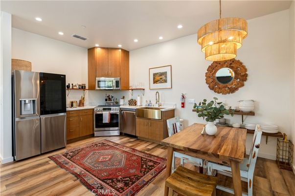 Chandelier, Dining room, Interior, Kitchen, Recessed Lighting, Stainless Steel Appliances, Wood Texture Flooring