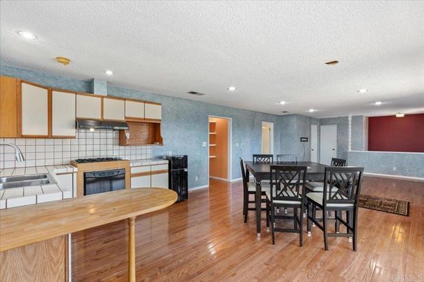 Dining room, Interior, Kitchen, Recessed Lighting, Tile Countertops, Wood Texture Flooring