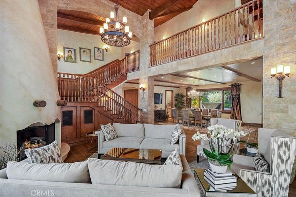 Chandelier, Dining room, Fireplace, Interior, Living room, Recessed Lighting, Stone Walls, Wooden Beams, Wooden Ceilings, Wood Texture Flooring