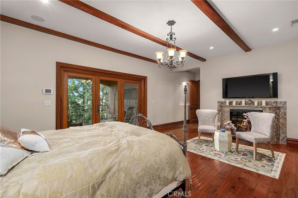 Bedroom, Chandelier, Fireplace, Interior, Recessed Lighting, Wooden Beams, Wood Texture Flooring