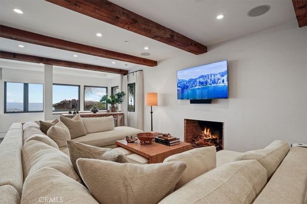 Fireplace, Interior, Living room, Recessed Lighting, Water, Wooden Beams