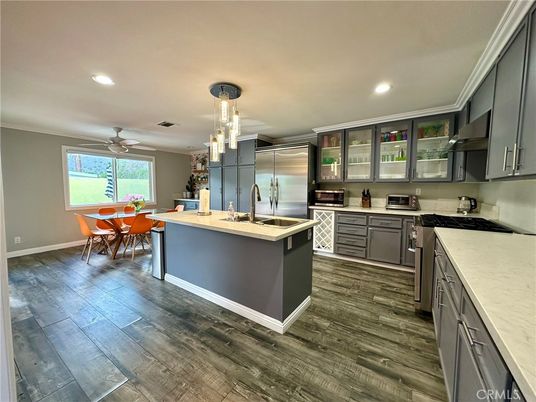 Dining room, Interior, Kitchen, Pendant Lights, Recessed Lighting, Stainless Steel Appliances, Wood Texture Flooring