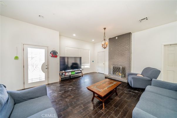 Fireplace, Interior, Living room, Pendant Lights, Recessed Lighting, Stone Walls, Wood Texture Flooring