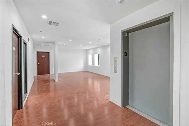 Elevator, Interior, Recessed Lighting, Wood Texture Flooring