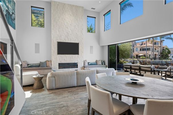 Dining room, Fireplace, Interior, Living room, Recessed Lighting, Wood Texture Flooring