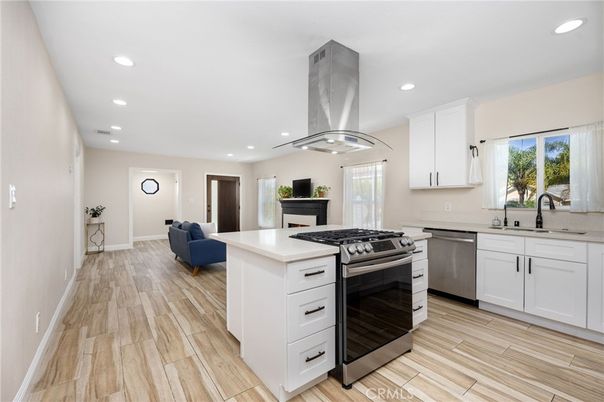 Fireplace, Interior, Kitchen, Recessed Lighting, Stainless Steel Appliances, Wood Texture Flooring