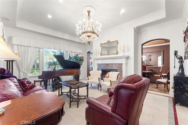 Chandelier, Fireplace, Interior, Living room, Piano, Recessed Lighting
