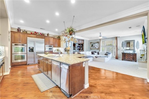 Fireplace, Interior, Kitchen, Living room, Recessed Lighting, Stainless Steel Appliances, Wood Texture Flooring