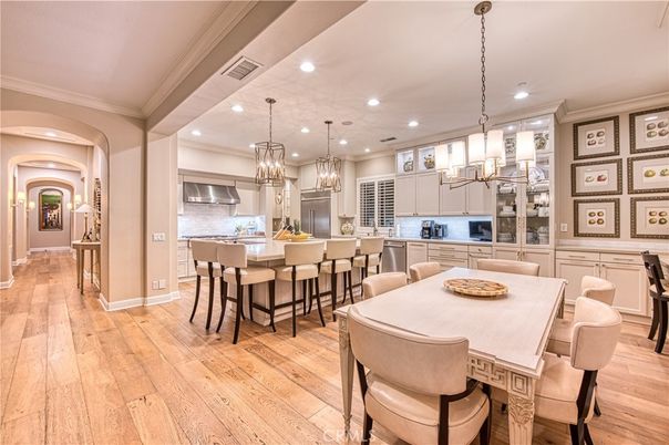 Chandelier, Dining room, Interior, Kitchen, Pendant Lights, Recessed Lighting, Stainless Steel Appliances, Wood Texture Flooring