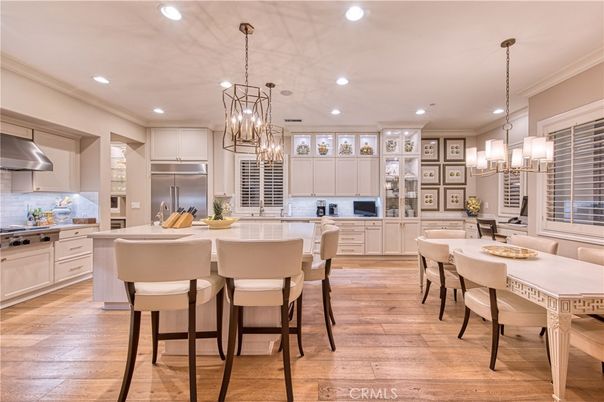 Chandelier, Dining room, Interior, Kitchen, Pendant Lights, Recessed Lighting, Stainless Steel Appliances, Wood Texture Flooring