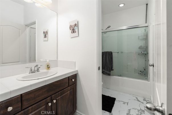 Bathroom, Glass Shower, Interior, Marble, Recessed Lighting, Tile Countertops