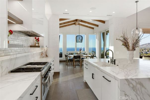 Dining room, Interior, Kitchen, Pendant Lights, Recessed Lighting, Stainless Steel Appliances, Water, Wooden Beams, Wood Texture Flooring
