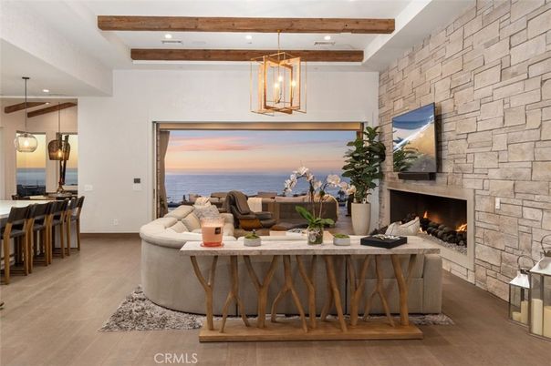 Fireplace, Interior, Living room, Pendant Lights, Recessed Lighting, Stone Walls, Water, Wooden Beams, Wood Texture Flooring
