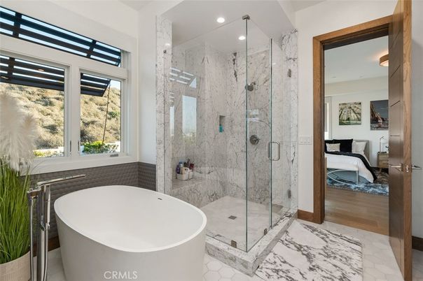 Bathroom, Free Standing Baths, Glass Shower, Interior, Marble, Marble Walls, Recessed Lighting, Wood Texture Flooring