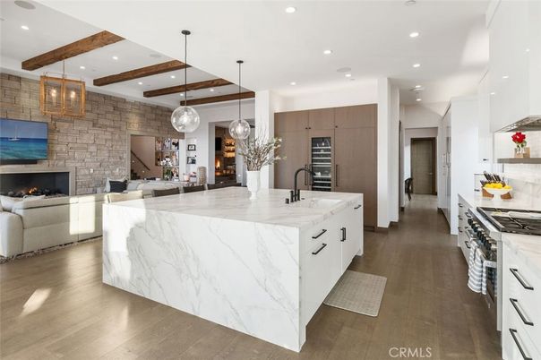 Fireplace, Interior, Kitchen, Living room, Pendant Lights, Recessed Lighting, Stainless Steel Appliances, Stone Walls, Wooden Beams, Wood Texture Flooring