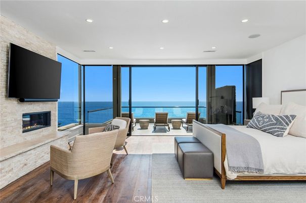 Bedroom, Fireplace, Interior, Living room, Recessed Lighting, Stone Walls, Water, Wood Texture Flooring