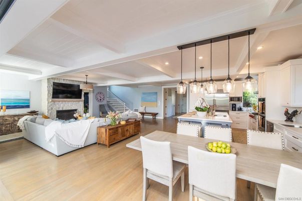 Dining room, Fireplace, Interior, Kitchen, Living room, Pendant Lights, Recessed Lighting, Stainless Steel Appliances, Water, Wood Texture Flooring