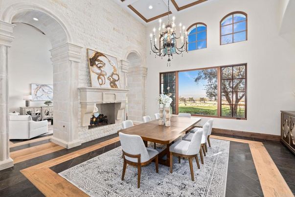 Chandelier, Dining room, Fireplace, Interior, Recessed Lighting, Stone Walls, Wood Texture Flooring