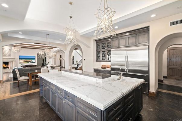 Chandelier, Dining room, Fireplace, Interior, Kitchen, Living room, Pendant Lights, Recessed Lighting, Stainless Steel Appliances