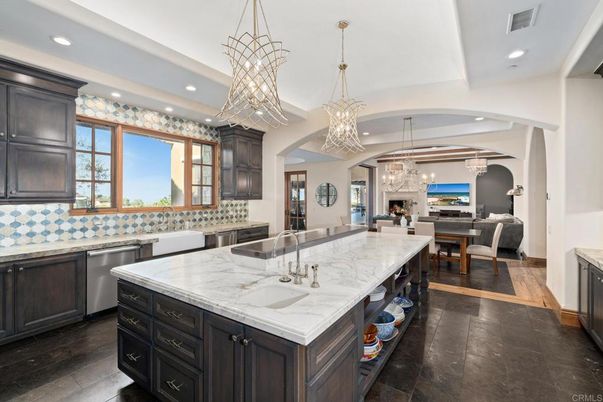Chandelier, Dining room, Fireplace, Interior, Kitchen, Living room, Pendant Lights, Recessed Lighting, Stainless Steel Appliances, Wood Texture Flooring