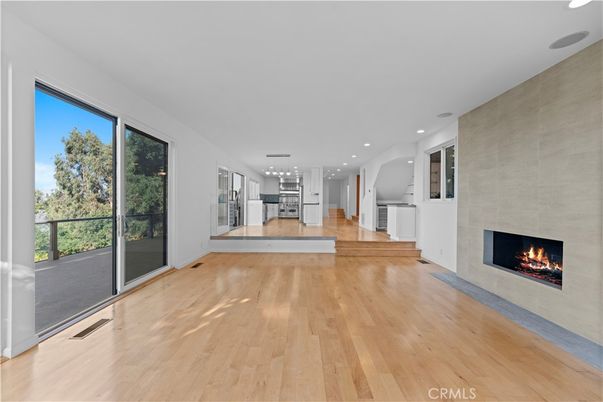 Empty room, Fireplace, Interior, Kitchen, Pendant Lights, Recessed Lighting, Wood Texture Flooring