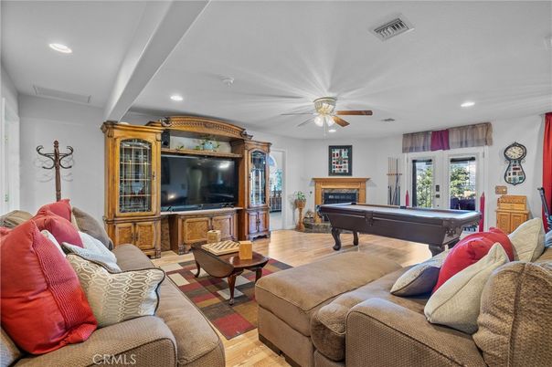 Billiard Table, Fireplace, Game Room, Interior, Living room, Recessed Lighting, Wood Texture Flooring