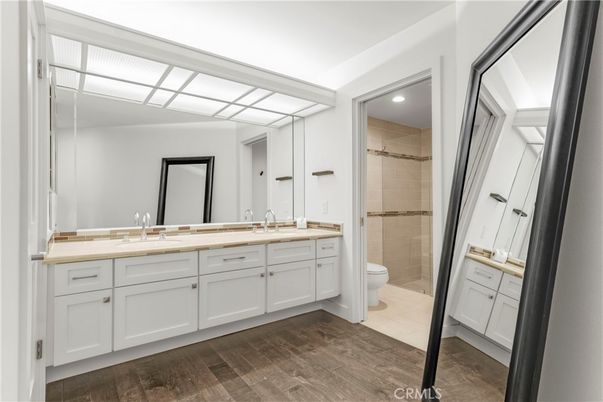 Bathroom, Dual Sink Vanities, Glass Shower, Interior, Recessed Lighting, Wood Texture Flooring