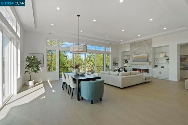 Dining room, Fireplace, Interior, Living room, Pendant Lights, Recessed Lighting, Stone Walls, Wood Texture Flooring
