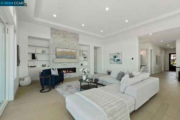 Fireplace, Interior, Living room, Recessed Lighting, Stone Walls, Wood Texture Flooring