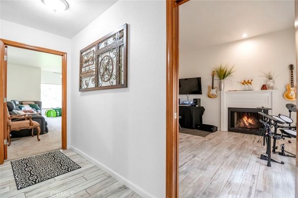 Fireplace, Fitness Equipment, Interior, Recessed Lighting, Wood Texture Flooring