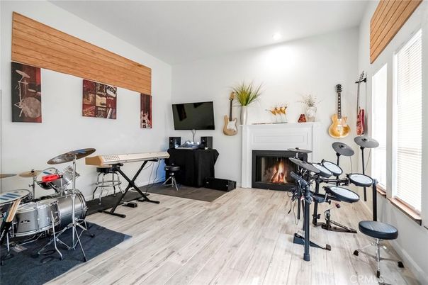 Fireplace, Fitness Equipment, Interior, Recessed Lighting, Wood Texture Flooring
