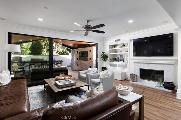 Fireplace, Interior, Living room, Recessed Lighting, Stone Walls, Wood Texture Flooring