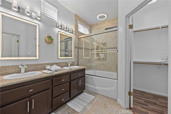 Bathroom, Dual Sink Vanities, Glass Shower, Interior, Recessed Lighting, Wood Texture Flooring