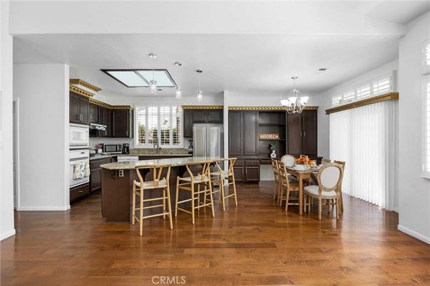 Chandelier, Dining room, Interior, Kitchen, Pendant Lights, Recessed Lighting, Stainless Steel Appliances, Wood Texture Flooring