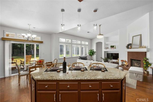 Chandelier, Dining room, Fireplace, Interior, Living room, Pendant Lights, Wood Texture Flooring